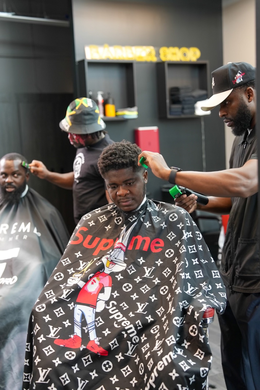 Simba and Ace working with clients inside Barberhood York U